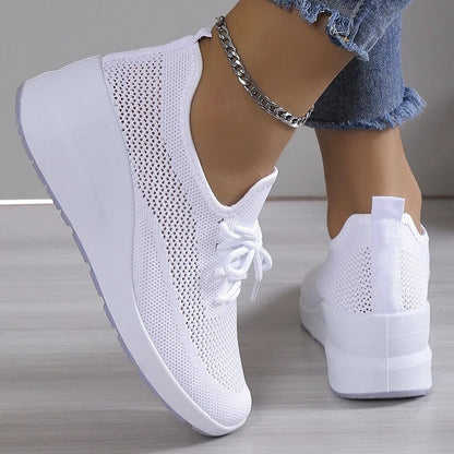 Women's athletic shoes featuring a mesh upper and a non-slip sole. 6