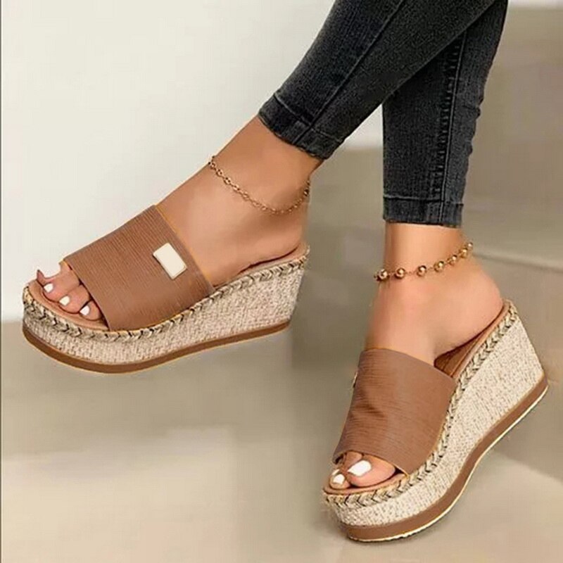 Women's wedge espadrilles featuring a woven sole and a wide strap. 2