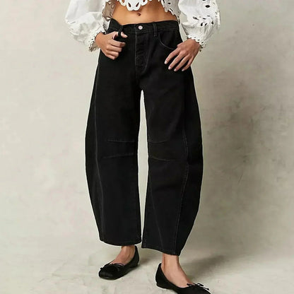 Loose high-waisted women's jeans displayed on a flat surface, featuring a relaxed fit and a classic five-pocket design. 3