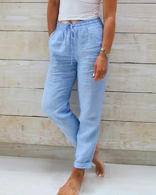 Light blue women's linen pants featuring an elastic waistband and a classic cut. 0