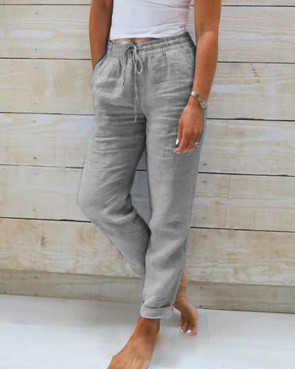 Light blue women's linen pants featuring an elastic waistband and a classic cut. 2