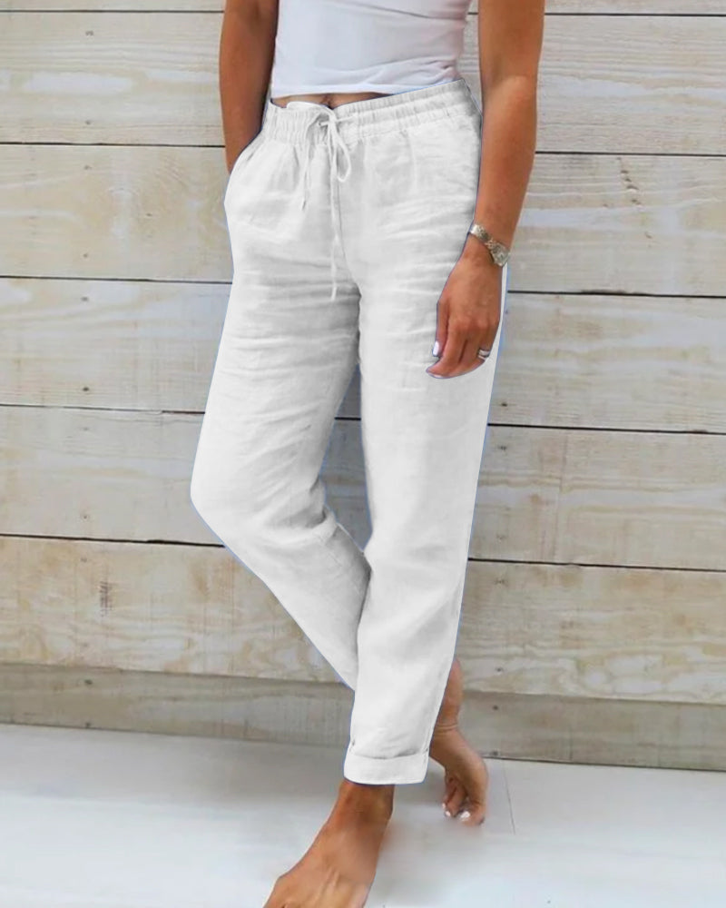 Light blue women's linen pants featuring an elastic waistband and a classic cut. 5