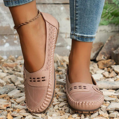Womens slip-on loafers with perforated design on a flat sole. 10