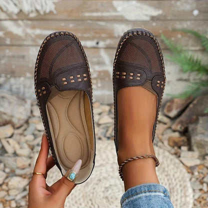 Womens slip-on loafers with perforated design on a flat sole. 3