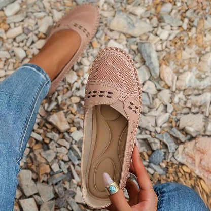 Womens slip-on loafers with perforated design on a flat sole. 4