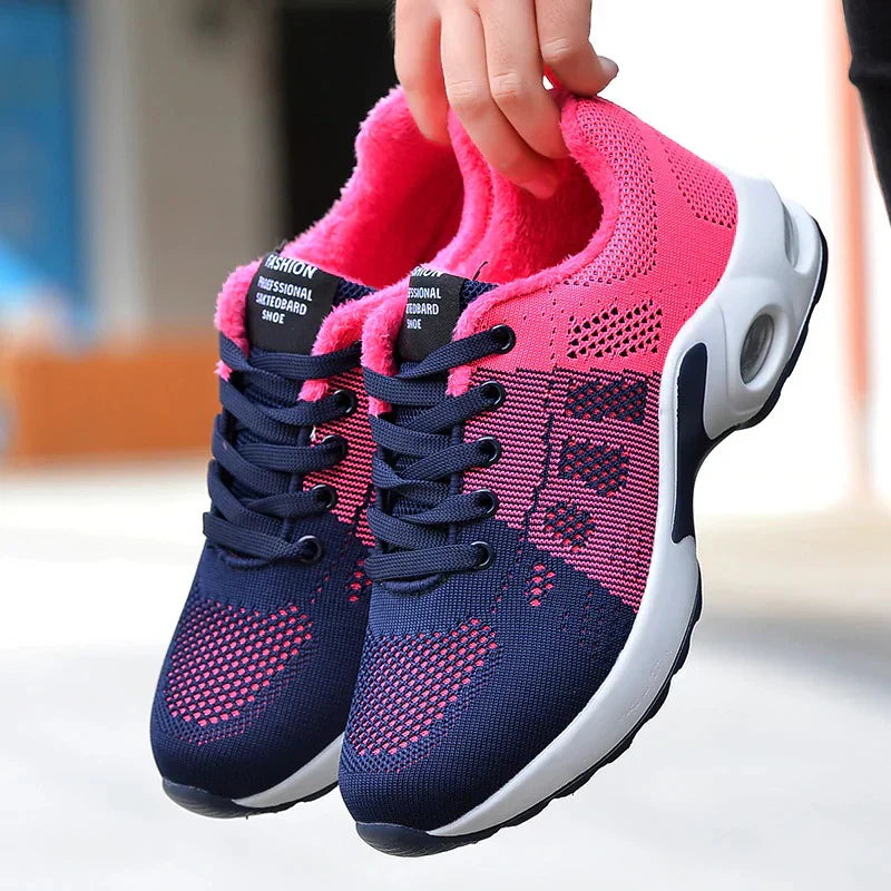 Sport shoes for women featuring a thick sole, showcasing a blend of pink and navy colors. 1