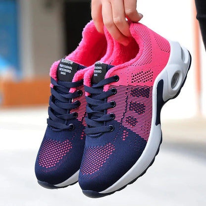Sport shoes for women featuring a thick sole, showcasing a blend of pink and navy colors. 1