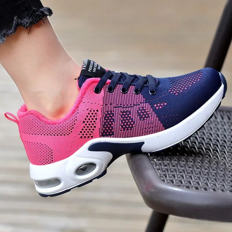 Sport shoes for women featuring a thick sole, showcasing a blend of pink and navy colors. 2