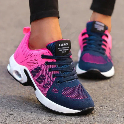 Sport shoes for women featuring a thick sole, showcasing a blend of pink and navy colors. 3