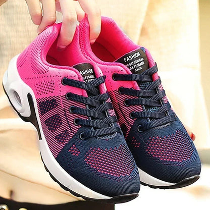 Sport shoes for women featuring a thick sole, showcasing a blend of pink and navy colors. 4