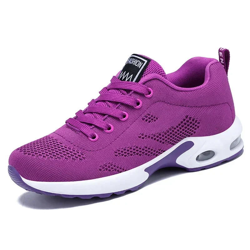 Sport shoes for women featuring a thick sole, showcasing a blend of pink and navy colors. 6