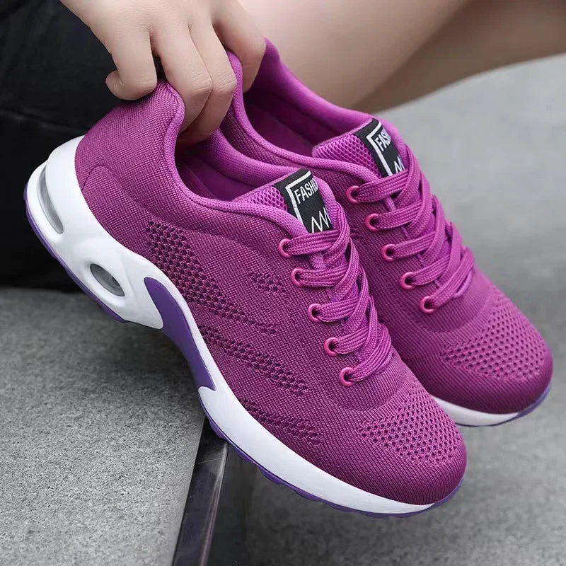 Sport shoes for women featuring a thick sole, showcasing a blend of pink and navy colors. 7