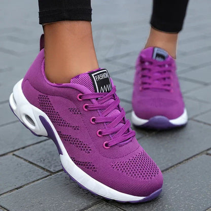 Sport shoes for women featuring a thick sole, showcasing a blend of pink and navy colors. 8