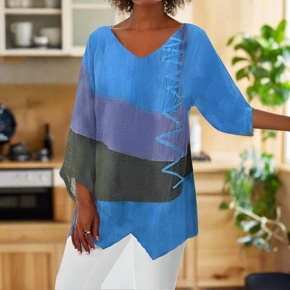 Three-color women's blouse with a classic cut, featuring a round neckline and short sleeves, displayed on a plain background. 3