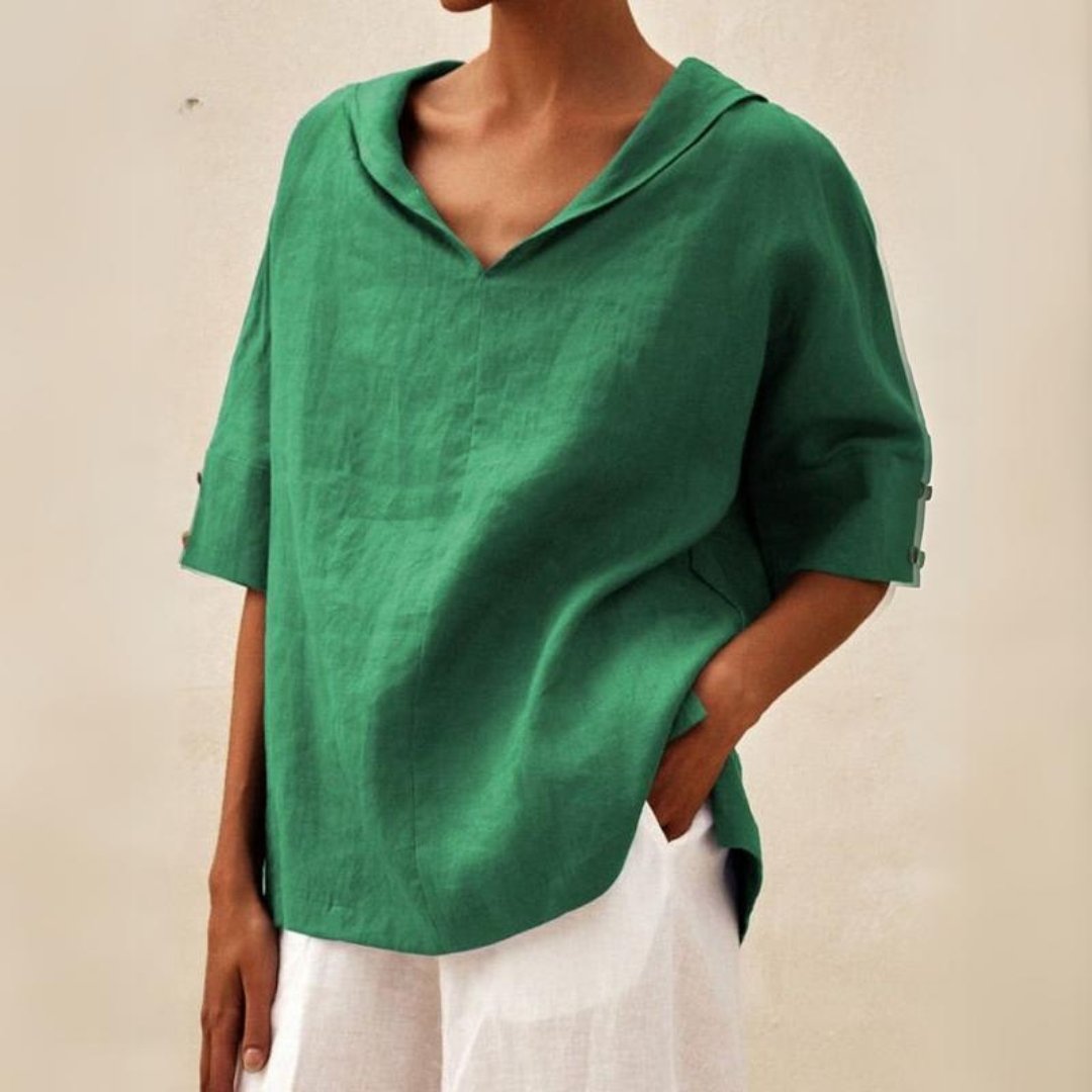 Loose women's top with a V-neck design, suitable for spring, featuring a relaxed fit and stylish silhouette. 0