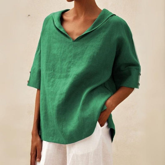 Loose women's top with a V-neck design, suitable for spring, featuring a relaxed fit and stylish silhouette. 0