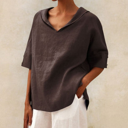 Loose women's top with a V-neck design, suitable for spring, featuring a relaxed fit and stylish silhouette. 3