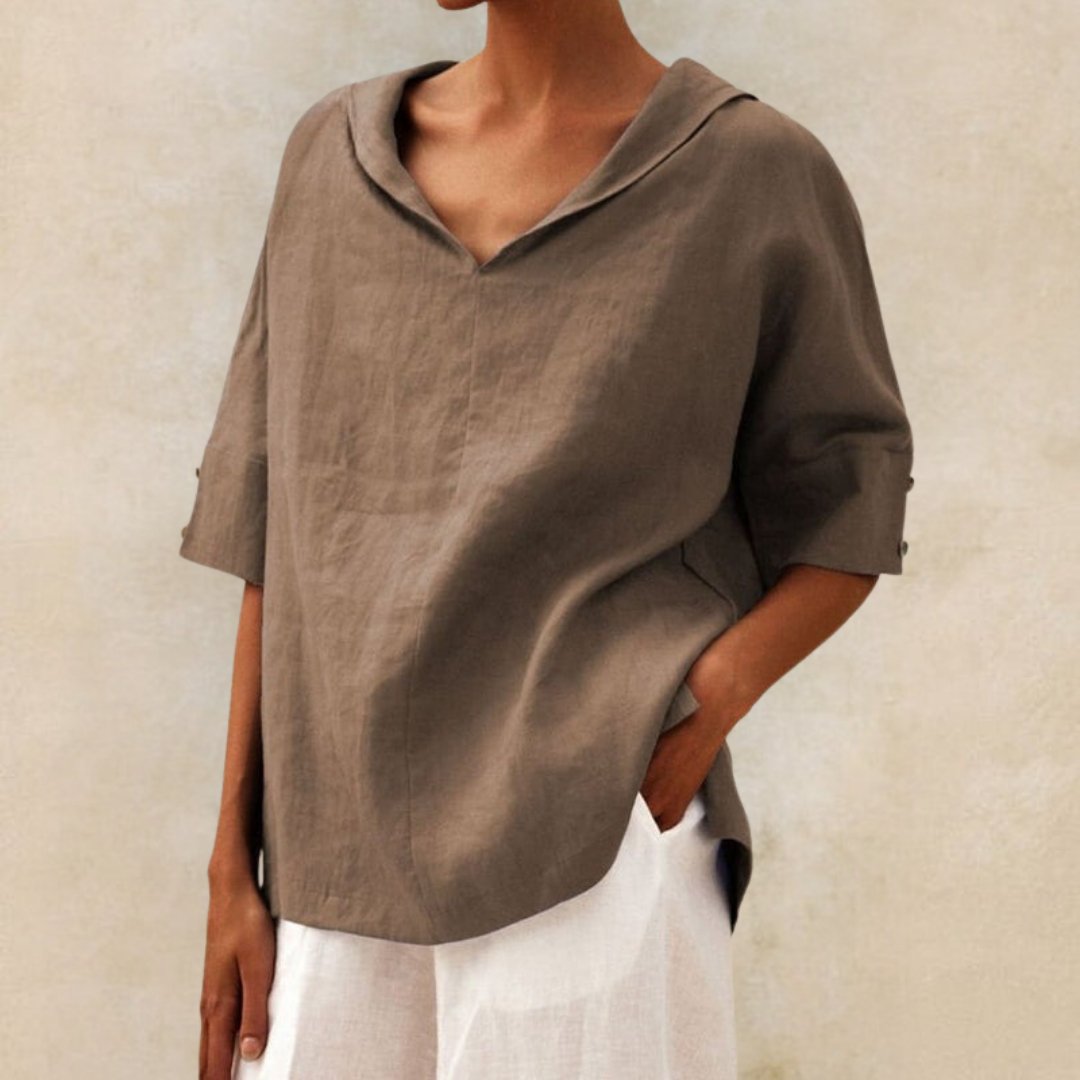 Loose women's top with a V-neck design, suitable for spring, featuring a relaxed fit and stylish silhouette. 4