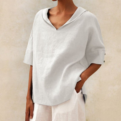 Loose women's top with a V-neck design, suitable for spring, featuring a relaxed fit and stylish silhouette. 5