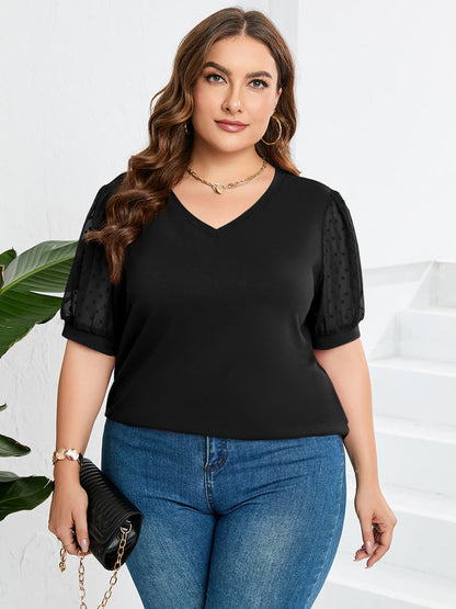 Women’s top featuring a V-neckline and puff sleeves, designed for a stylish look. 2