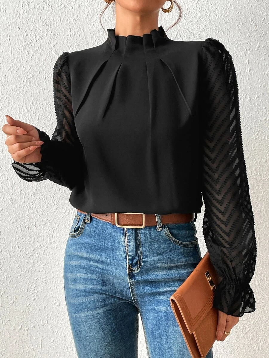 A women's top featuring pleated sleeves and a round neckline, displayed on a mannequin against a neutral background. 0