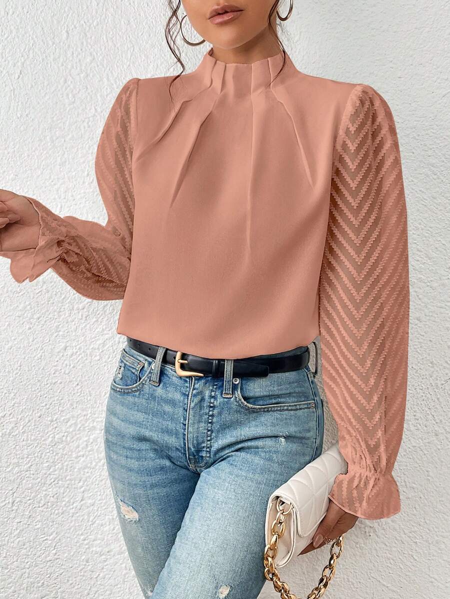 A women's top featuring pleated sleeves and a round neckline, displayed on a mannequin against a neutral background. 5