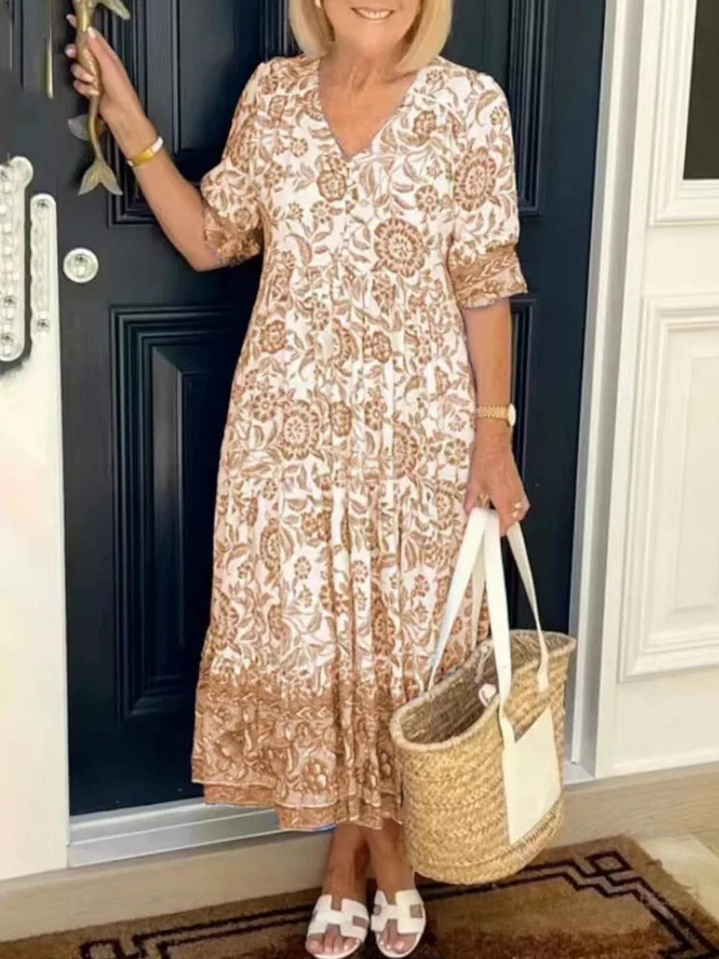 Maxi dress featuring a floral design with a flowing silhouette, suitable for summer wear. 0