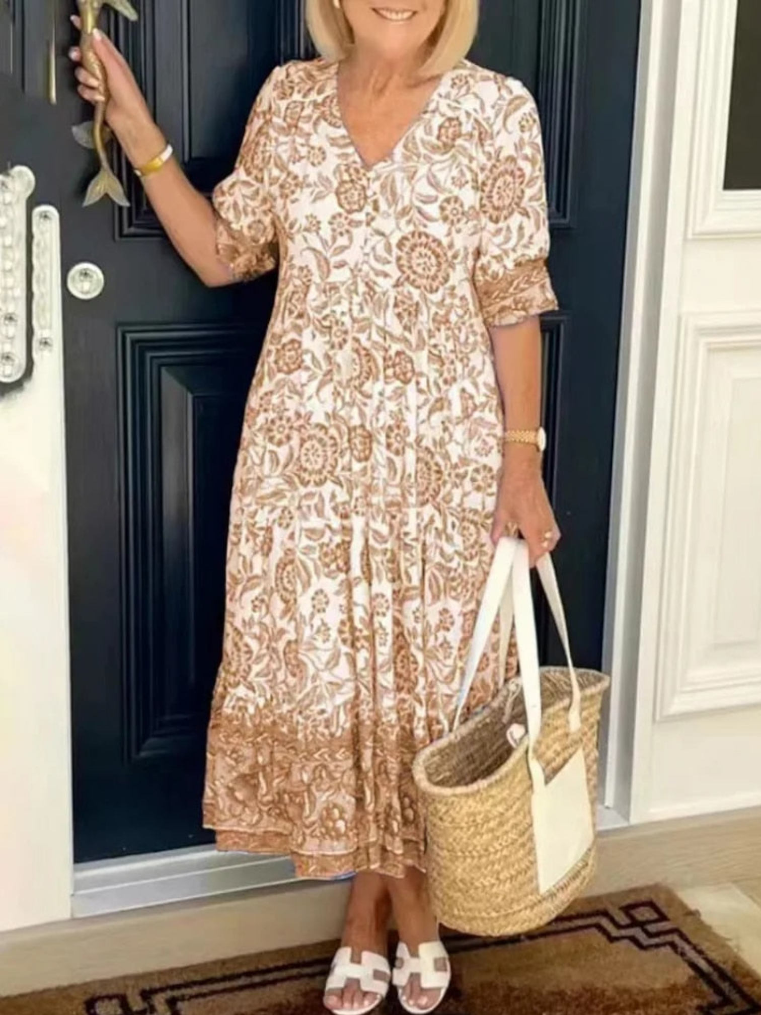 Maxi dress featuring a floral design with a flowing silhouette, suitable for summer wear. 0