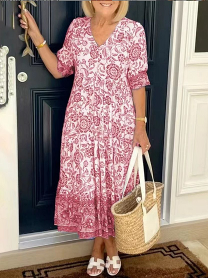 Maxi dress featuring a floral design with a flowing silhouette, suitable for summer wear. 3