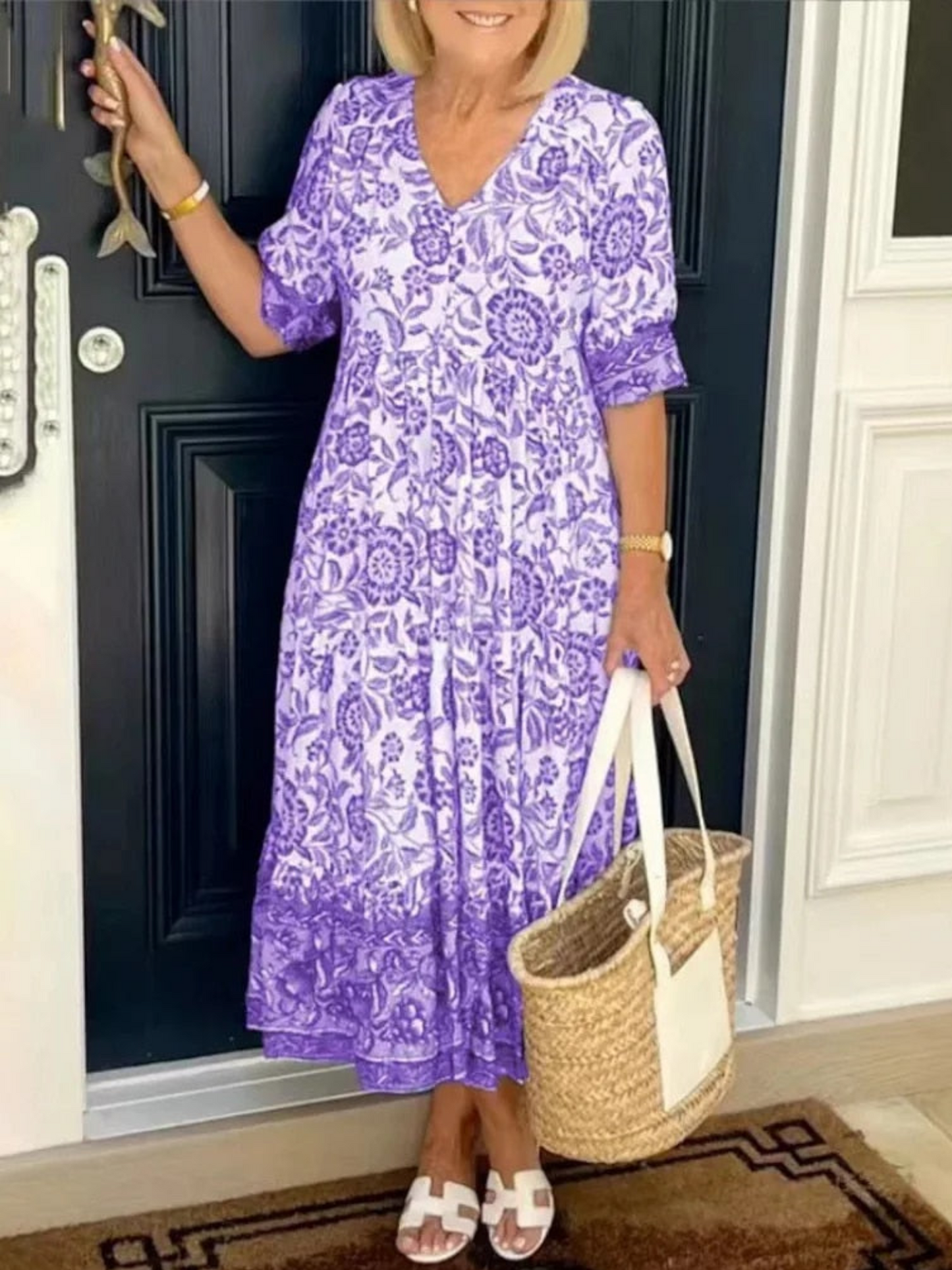 Maxi dress featuring a floral design with a flowing silhouette, suitable for summer wear. 4