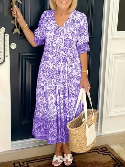 Maxi dress featuring a floral design with a flowing silhouette, suitable for summer wear. 4