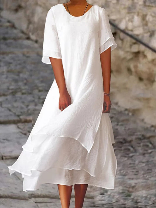 Lightweight women's dress with short sleeves and a stylish cut, featuring a fitted bodice and a flared skirt design. 0