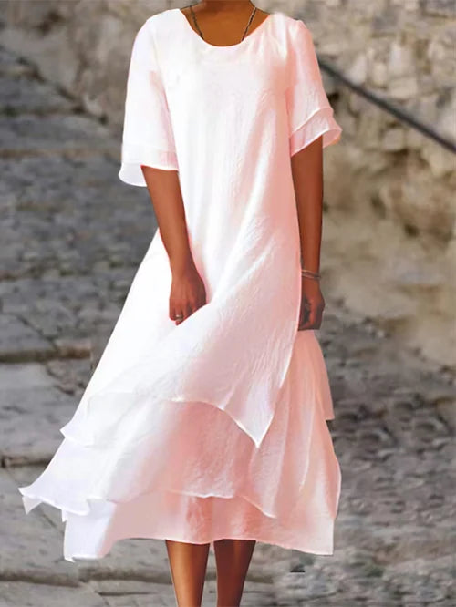 Lightweight women's dress with short sleeves and a stylish cut, featuring a fitted bodice and a flared skirt design. 2