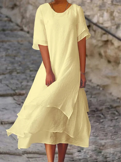 Lightweight women's dress with short sleeves and a stylish cut, featuring a fitted bodice and a flared skirt design. 3