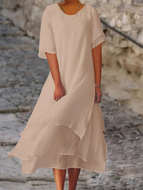 Lightweight women's dress with short sleeves and a stylish cut, featuring a fitted bodice and a flared skirt design. 5