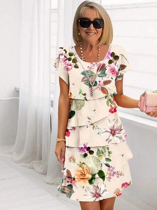 Mini dress featuring a floral pattern and ruffle detailing, designed for summer wear. 0