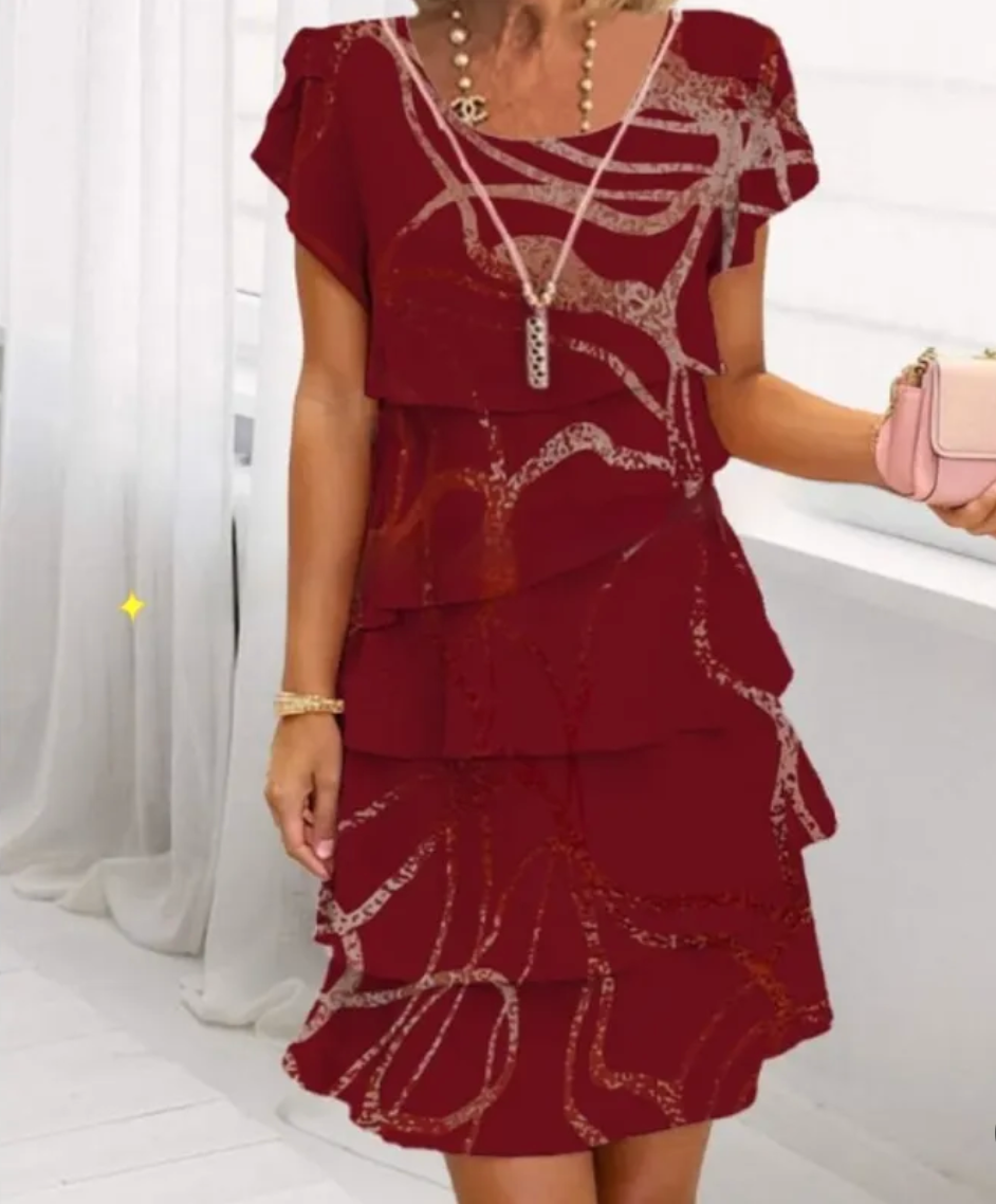 Mini dress featuring a floral pattern and ruffle detailing, designed for summer wear. 10