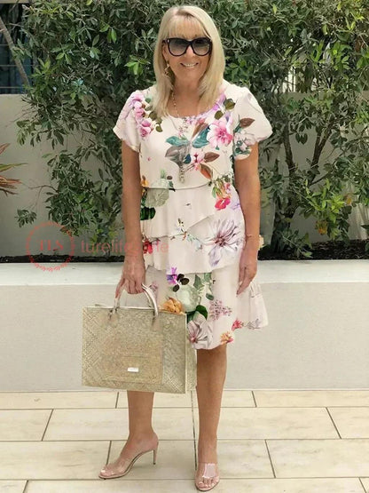 Mini dress featuring a floral pattern and ruffle detailing, designed for summer wear. 5