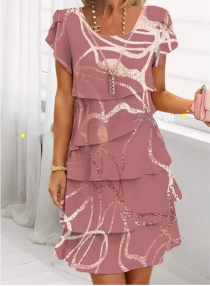 Mini dress featuring a floral pattern and ruffle detailing, designed for summer wear. 7