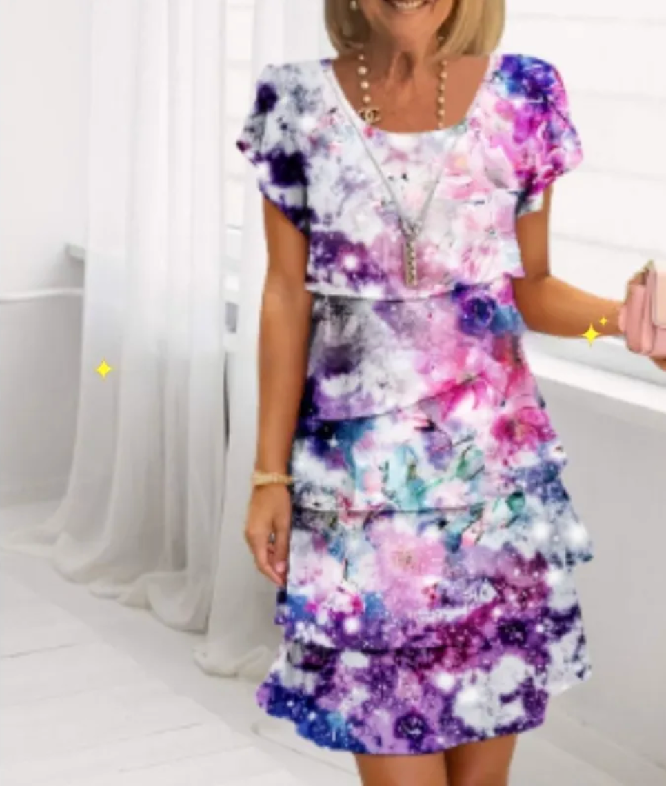 Mini dress featuring a floral pattern and ruffle detailing, designed for summer wear. 9