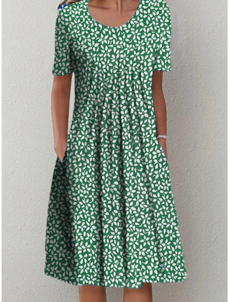 Floral dress with pockets and a flattering cut, displayed on a mannequin. 8
