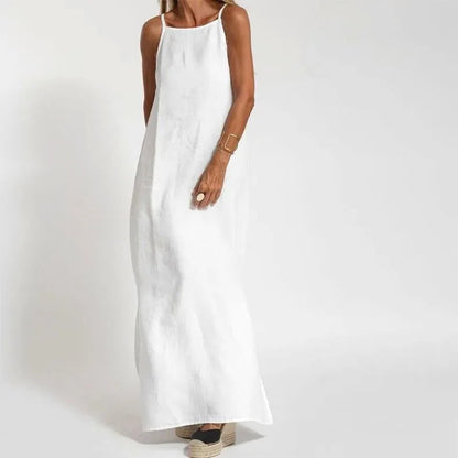 Maxi summer dress with straps featuring a breezy design, shown hanging on a hanger against a neutral background. 0