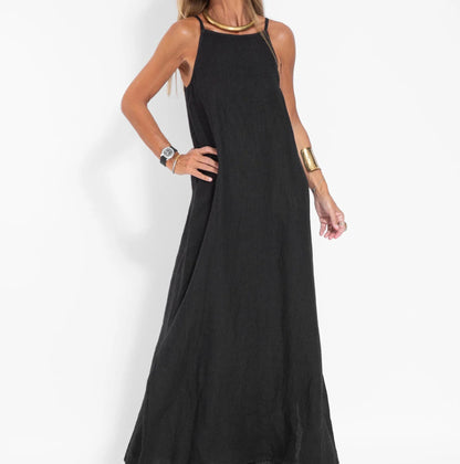 Maxi summer dress with straps featuring a breezy design, shown hanging on a hanger against a neutral background. 3