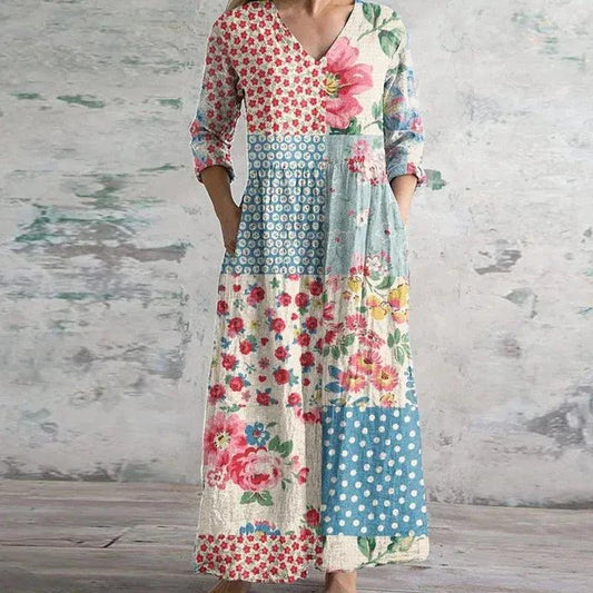 Maxi dress with a floral print and long sleeves, designed for summer wear. 0