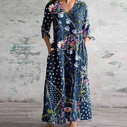 Maxi dress with a floral print and long sleeves, designed for summer wear. 1
