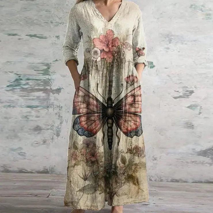 Maxi dress with a floral print and long sleeves, designed for summer wear. 2