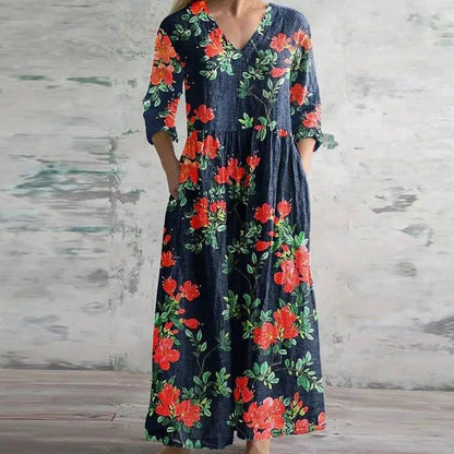 Maxi dress with a floral print and long sleeves, designed for summer wear. 3