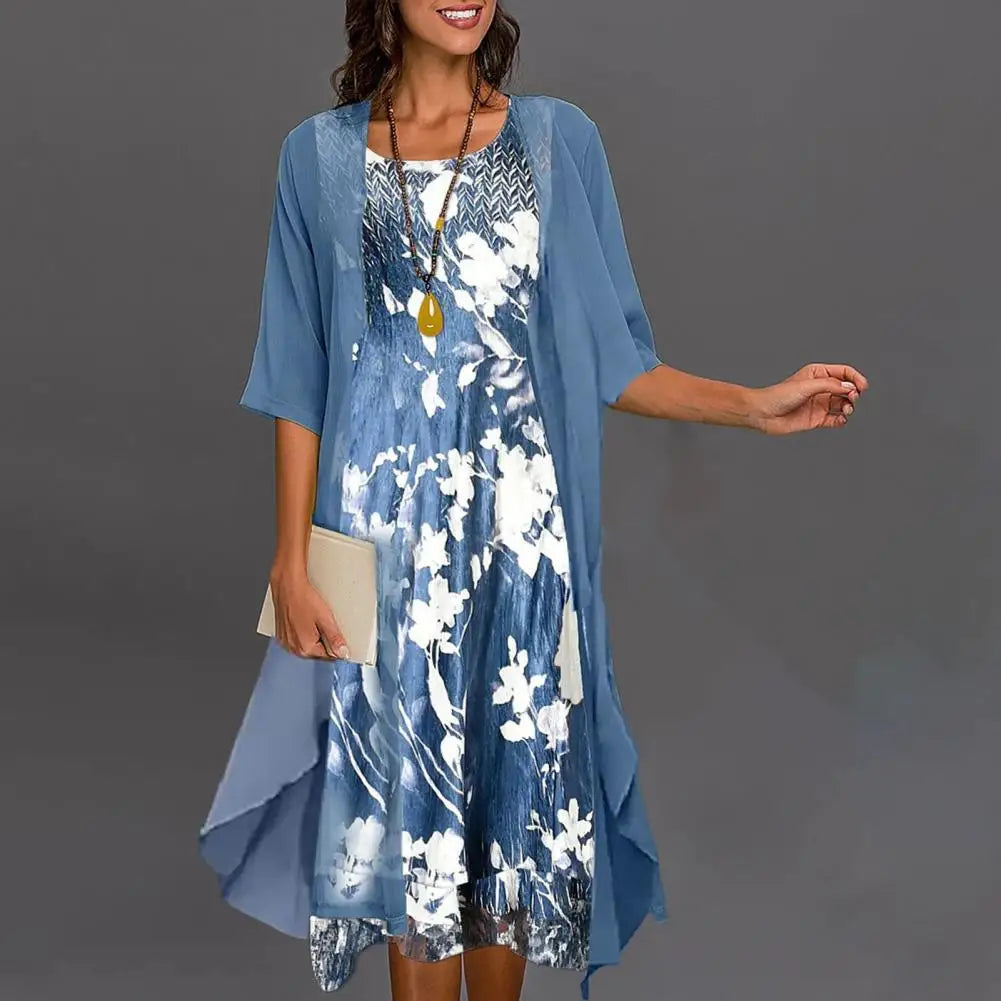 A long-sleeved evening dress displayed on a mannequin, featuring a fitted bodice and flowing skirt, showcasing its elegant design and comfortable fit. 0