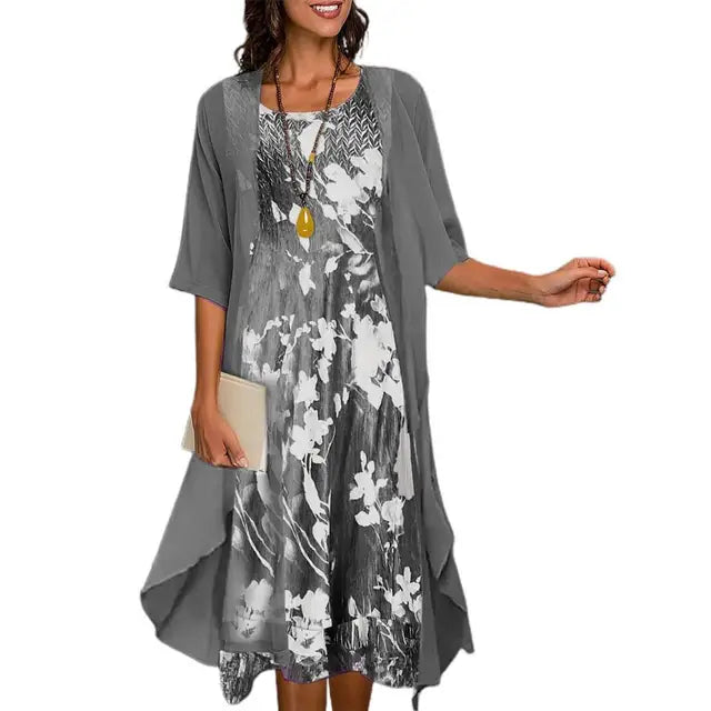 A long-sleeved evening dress displayed on a mannequin, featuring a fitted bodice and flowing skirt, showcasing its elegant design and comfortable fit. 3
