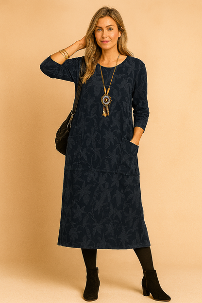 A winter dress featuring long sleeves and pockets, designed for women's fashion. 1